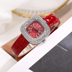 Macro detail of Tadi watch showing square diamond-encrusted bezel and red leather strap