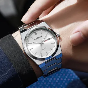 Close-up of men's stainless steel quartz watch with dual calendar on a suit sleeve