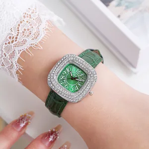Elegant green sunburst dial watch with diamond-encrusted bezel on leather strap