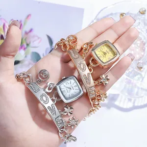 Montre bracelet élégante en or et argent avec pendentif LOVE et strass brillants