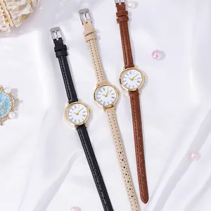 French vintage small round dial watch with slim leather straps in black and brown colors