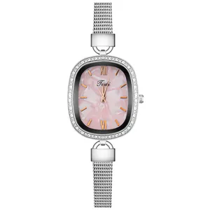Macro shot of oval watch with crystal bezel and pink mother of pearl dial detail