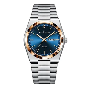Detailed macro of the blue dial quartz watch with day-date display and steel strap