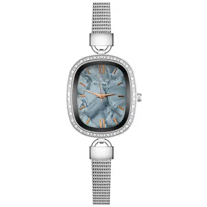 Detailed close-up of oval quartz watch with blue marble dial and crystal bezel
