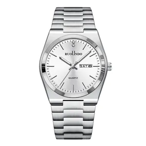 Front macro view of silver stainless steel men's watch with white dial and day-date display.