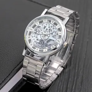 Macro view of skeleton watch dial showing intricate silver mechanical gears and Roman numerals