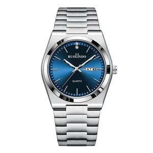 Close-up of the sunray blue dial with dual calendar display and polished steel links