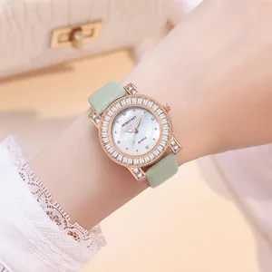 Women's luxury quartz watch with diamond-set bezel and mint green leather strap
