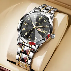 Macro shot of gold and silver quartz watch with dual calendar display and roman numerals