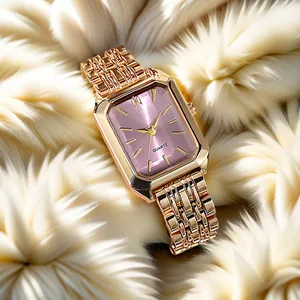 Close-up of rose gold rectangular quartz watch with purple dial on soft white fur texture