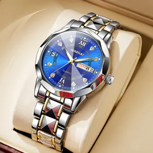 Detail of blue sunray dial with day-date display and gold hands on a quartz watch