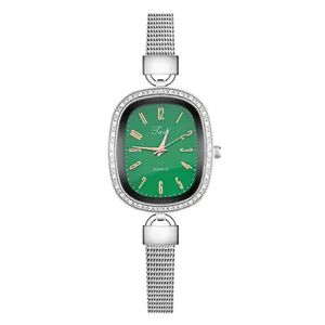 Detail of silver mesh band and green dial quartz watch with crystal-encrusted oval case