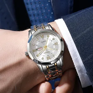 Close-up of business quartz watch with two-tone steel strap and day-date display