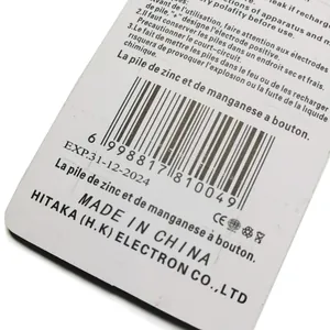 Close-up of button cell battery packaging with French instructions and expiry date detail
