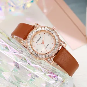 Detail of rose gold watch bezel set with crystals and pink mother of pearl dial