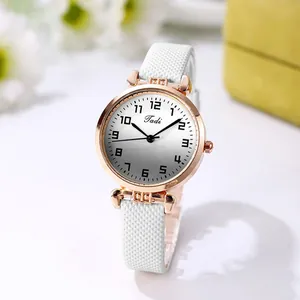 Detailed view of the Tadi rose gold watch with a white gradient dial and textured strap