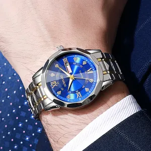 Close-up of double calendar quartz watch with blue sunray dial and steel strap