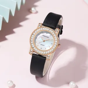 Detail of luxury watch with rose gold zircon bezel and colorful mother of pearl dial