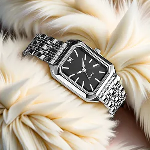 Detail of silver square watch with black dial and minimalist steel link strap