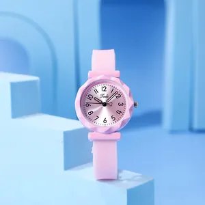 Detail of pink quartz watch with heart-shaped second hand and gem-cut faceted bezel