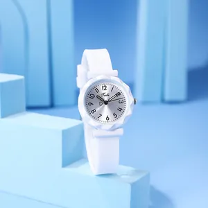 Minimalist white women's quartz watch with silicone strap and faceted diamond-cut bezel