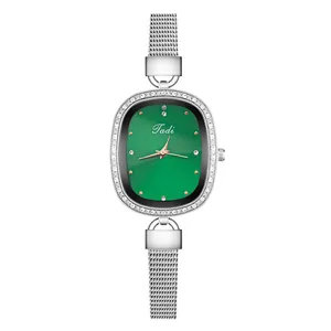 Elegant emerald green oval dial watch with silver mesh band and diamond-encrusted bezel