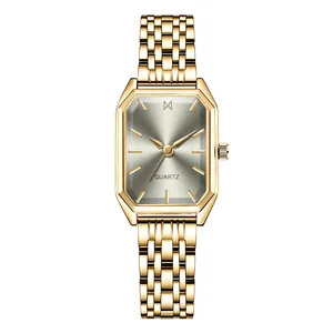 Detailed close-up of a gold octagonal quartz watch with sunburst grey dial and chain link strap