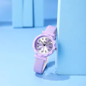 Detail of lavender quartz watch with gear-edge bezel and leather strap on blue background