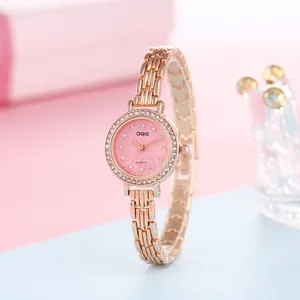 Detail of rose gold women's watch with pink spiral dial and diamond-set bezel