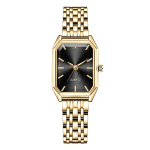 Detail of octagonal black dial and gold stainless steel link strap on women quartz watch