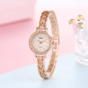 Close-up of rose gold ladies watch with crystal bezel and slim bracelet strap