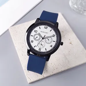 Macro detail of quartz watch face with three functional sub-dials and blue silicone strap