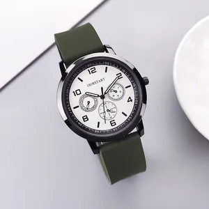 Detail of green silicone strap and black metal casing on this stylish quartz watch