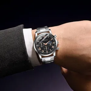 Detail of silver stainless steel business watch featuring black dial and roman numerals