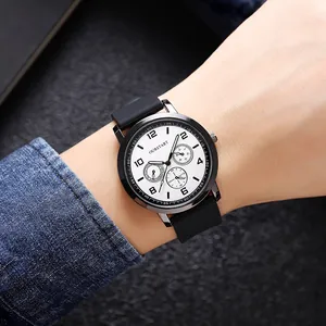 Close-up of minimalist sports quartz watch with silicone strap on male wrist
