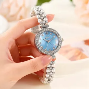 Montre à Quartz Élégante pour Femmes Bracelet Künstliche Perle Cadran en Nacre Strass Chiffres Romains Montre-Bracelet de Luxe Cadeau Bijoux