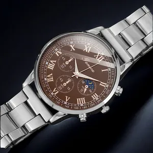 Detail of the silver stainless steel watch strap and the deep brown dial with gold indices