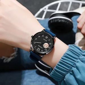 Close-up of a modern quartz watch featuring a black dial and blue silicone strap