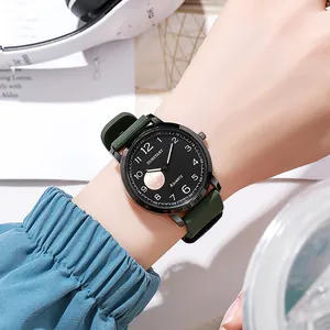 Detailed close-up of dark green silicone strap and large black dial of sports quartz watch