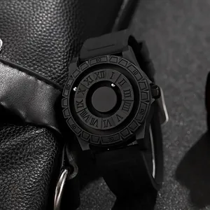 Detail of creative magnetic ball watch showing matte black case and roman numerals