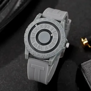 Detail view of magnetic ball watch with roman numerals and textured silicone strap