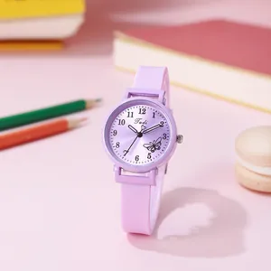 Close-up of purple student watch with butterfly dial and matching silicone strap