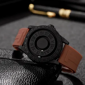 Macro detail of magnetic ball watch with roman numerals and brown silicone strap