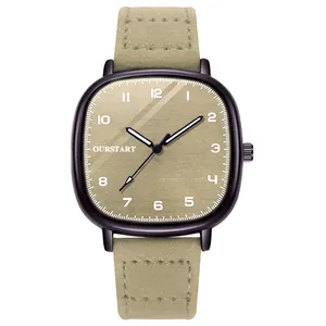 Macro detail of quartz watch with khaki leather strap and square champagne gold dial