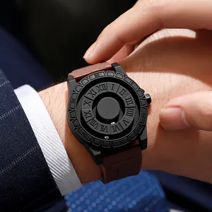 Close-up of magnetic ball watch with black case and brown strap on a business suit wrist