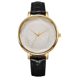 Elegant gold quartz watch with a 3D bow design and black leather strap on white background