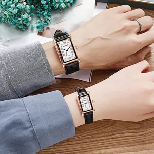 Close-up of rectangular quartz watches with diamond accents and leather straps on models