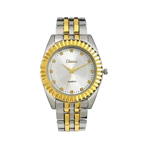 Classic silver and gold quartz watch with a sunray dial and fluted bezel on white background