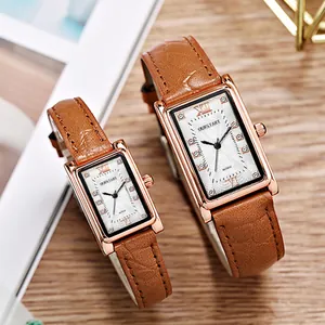 Elegant pair of square quartz watches with brown leather straps and rose gold diamond cases