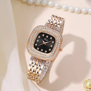 Detail of a vintage quartz watch featuring a diamond-set dial and bicolor steel strap